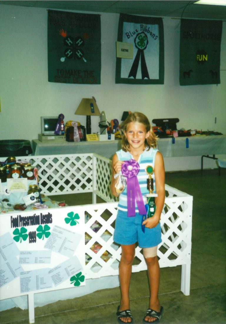 Stephanie as a child with an award