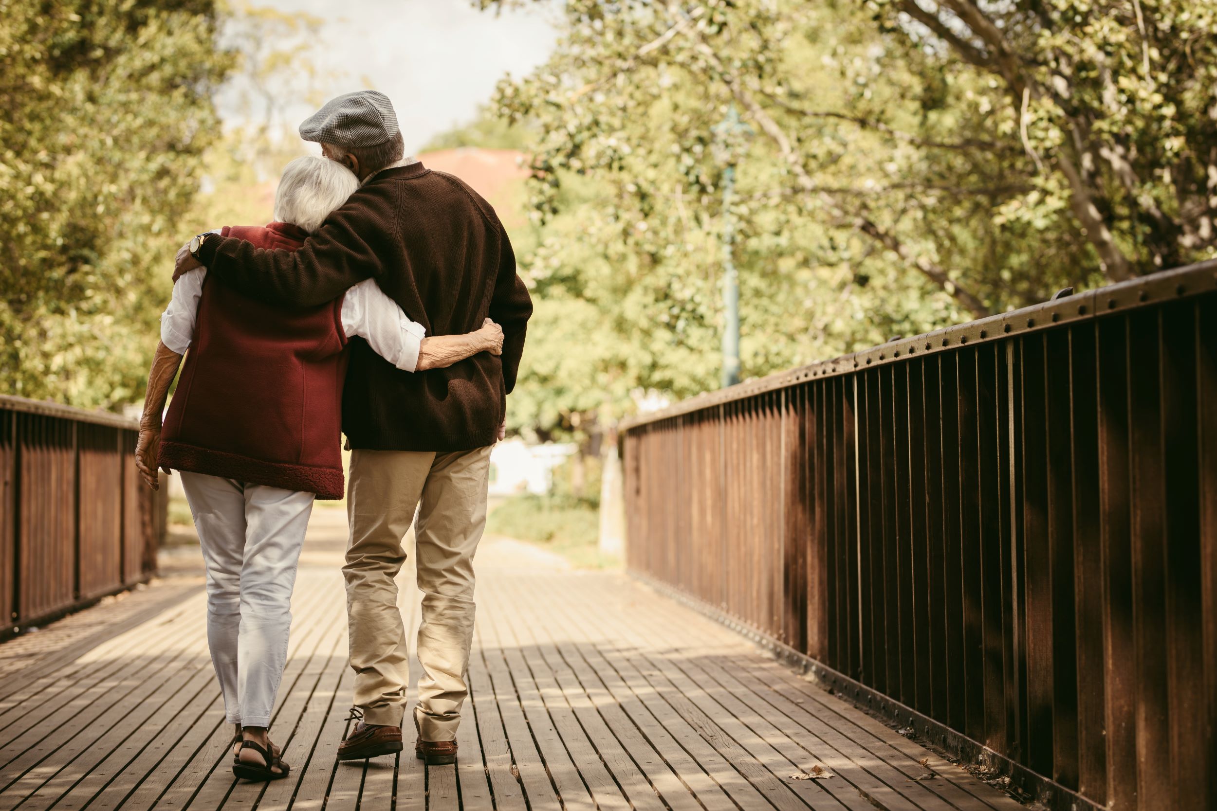 Older Couple Walking on Bridge