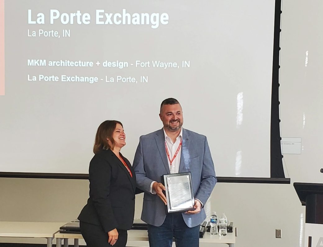 Andy Mitchell accepting award for La Porte Exchange