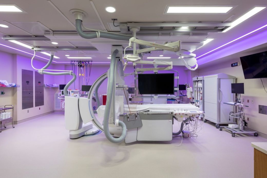 Lutheran Hospital IR Suite with equipment and soft purple overhead lighting