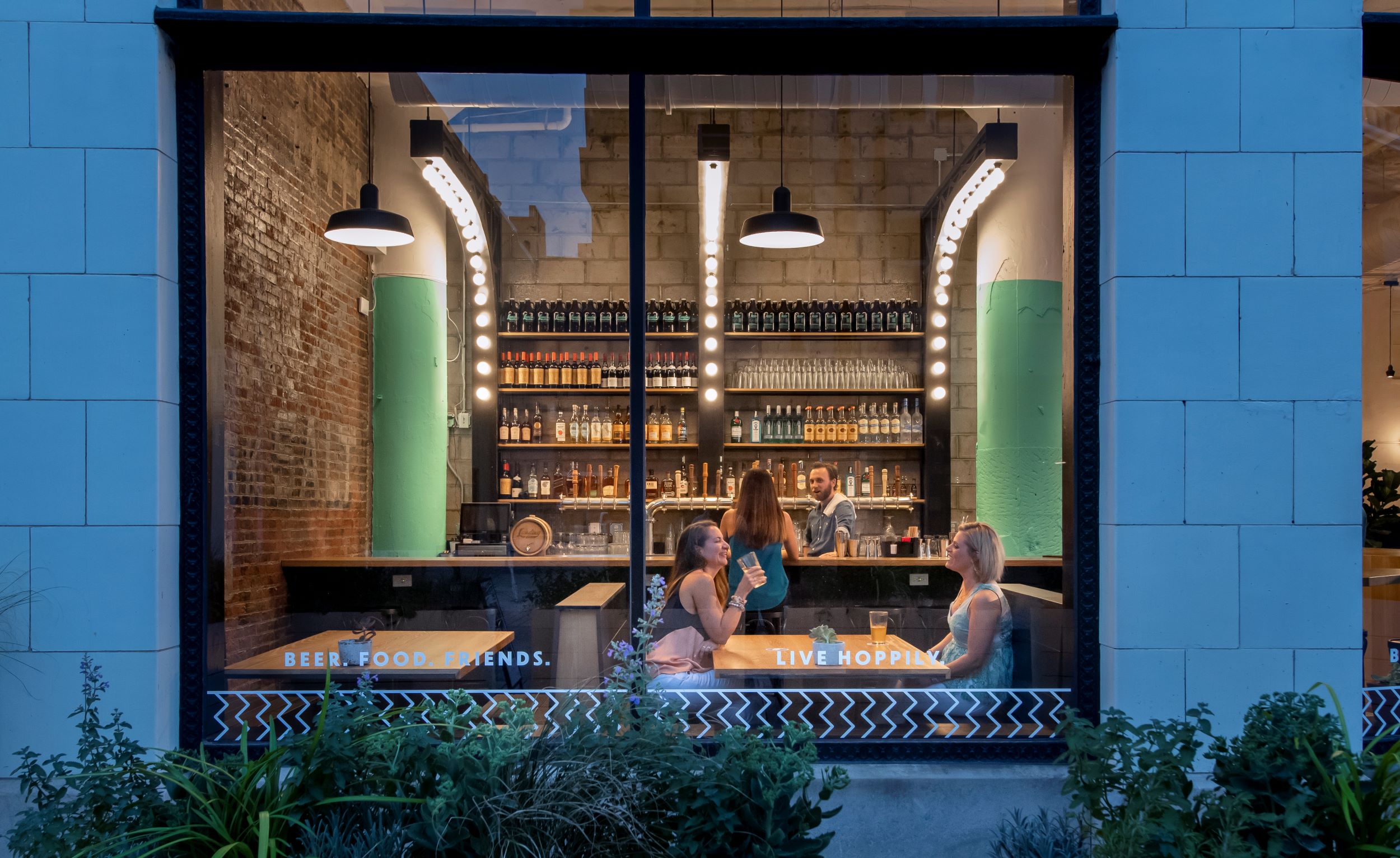 people sitting at table near window