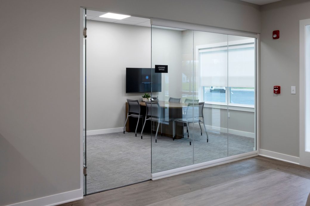 glass front office with table and chairs