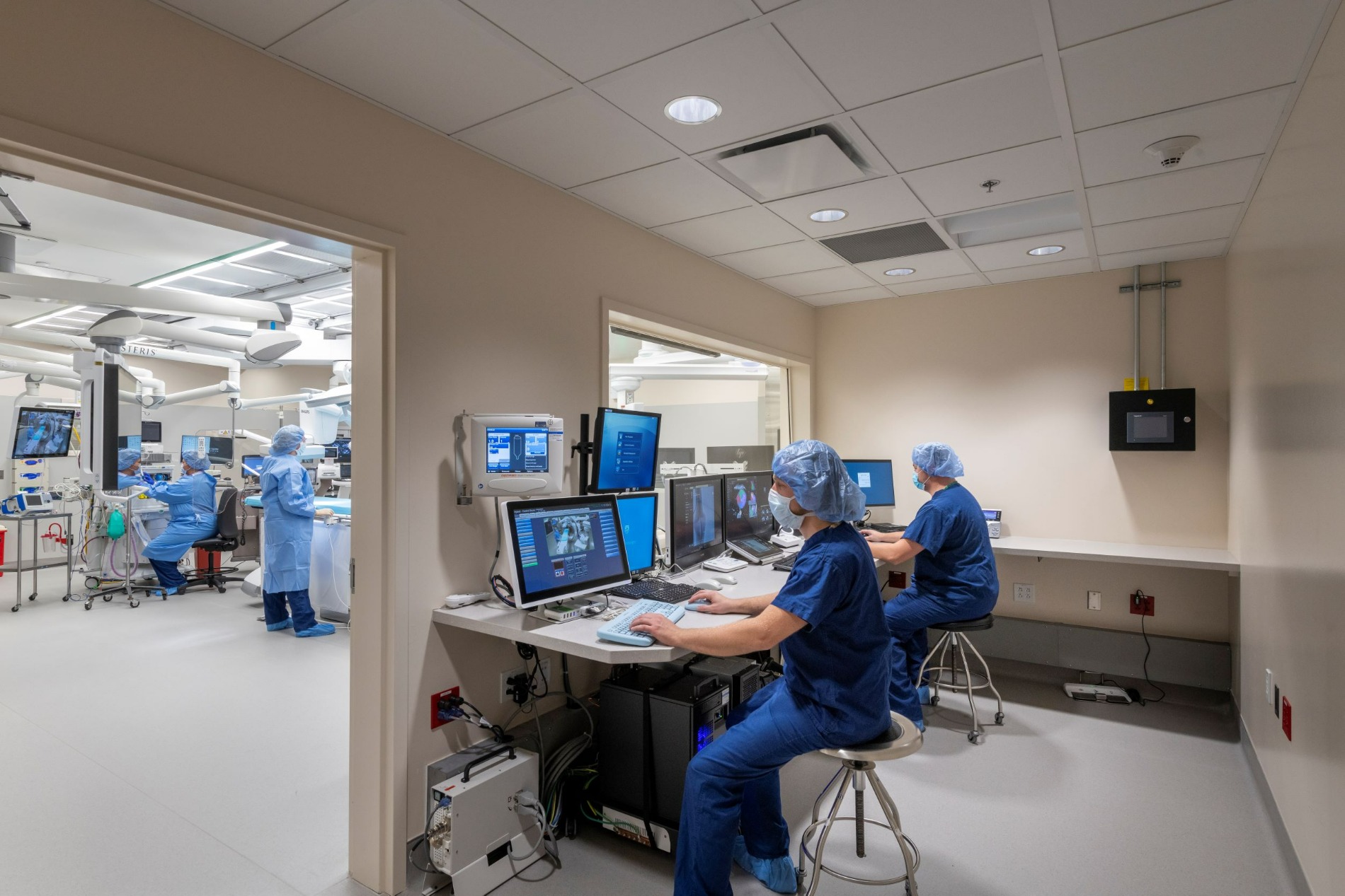 St Joseph Regional Medical Center Cath Lab Control Room side view with two people