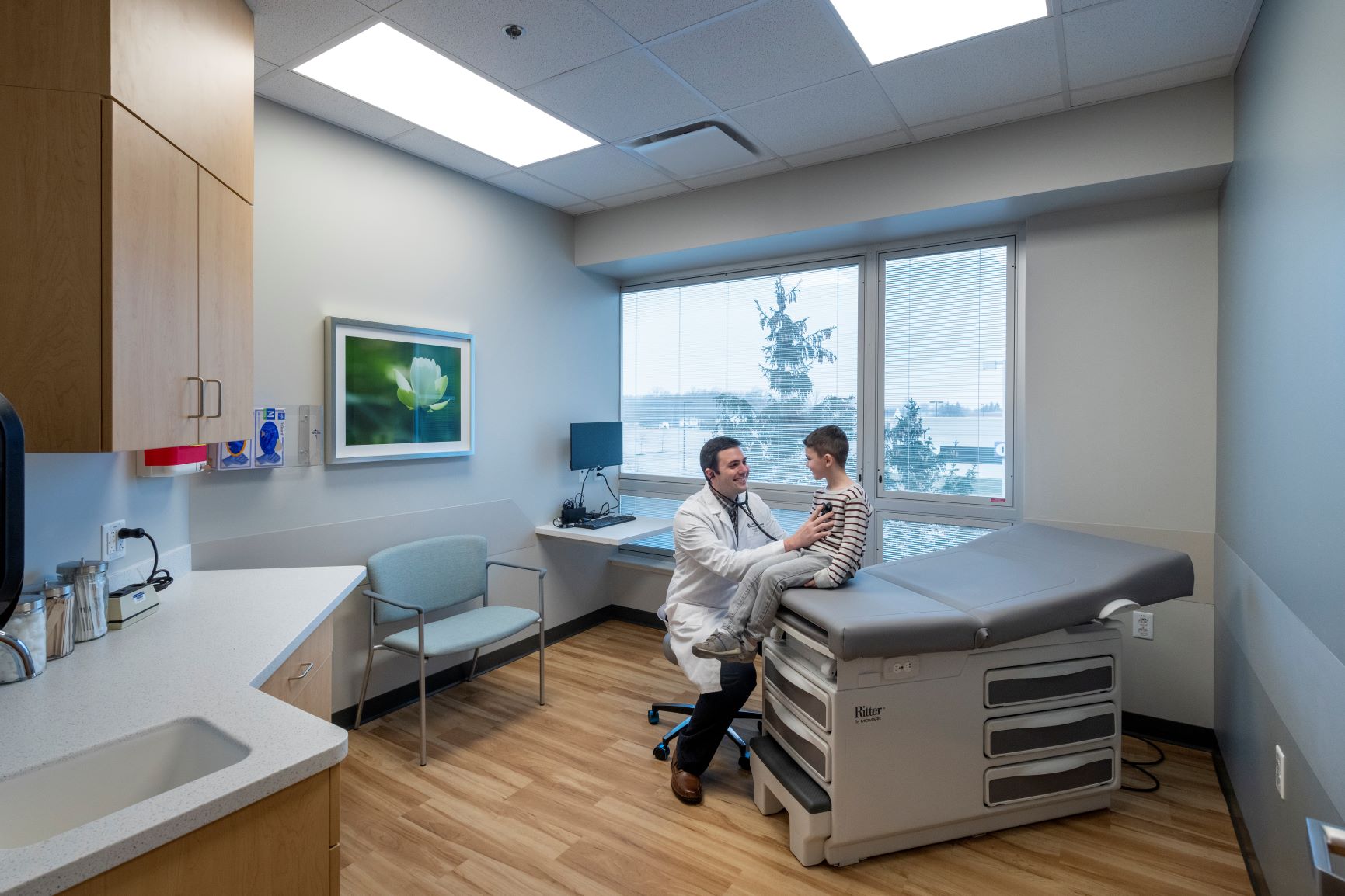 Lutheran Health Physicians Suite 200 doctor and young patient in exam room