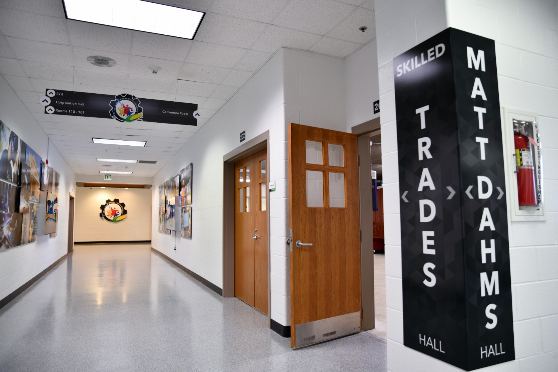 Whitko Career Academy hallway featuring wayfinding signage and wood doors