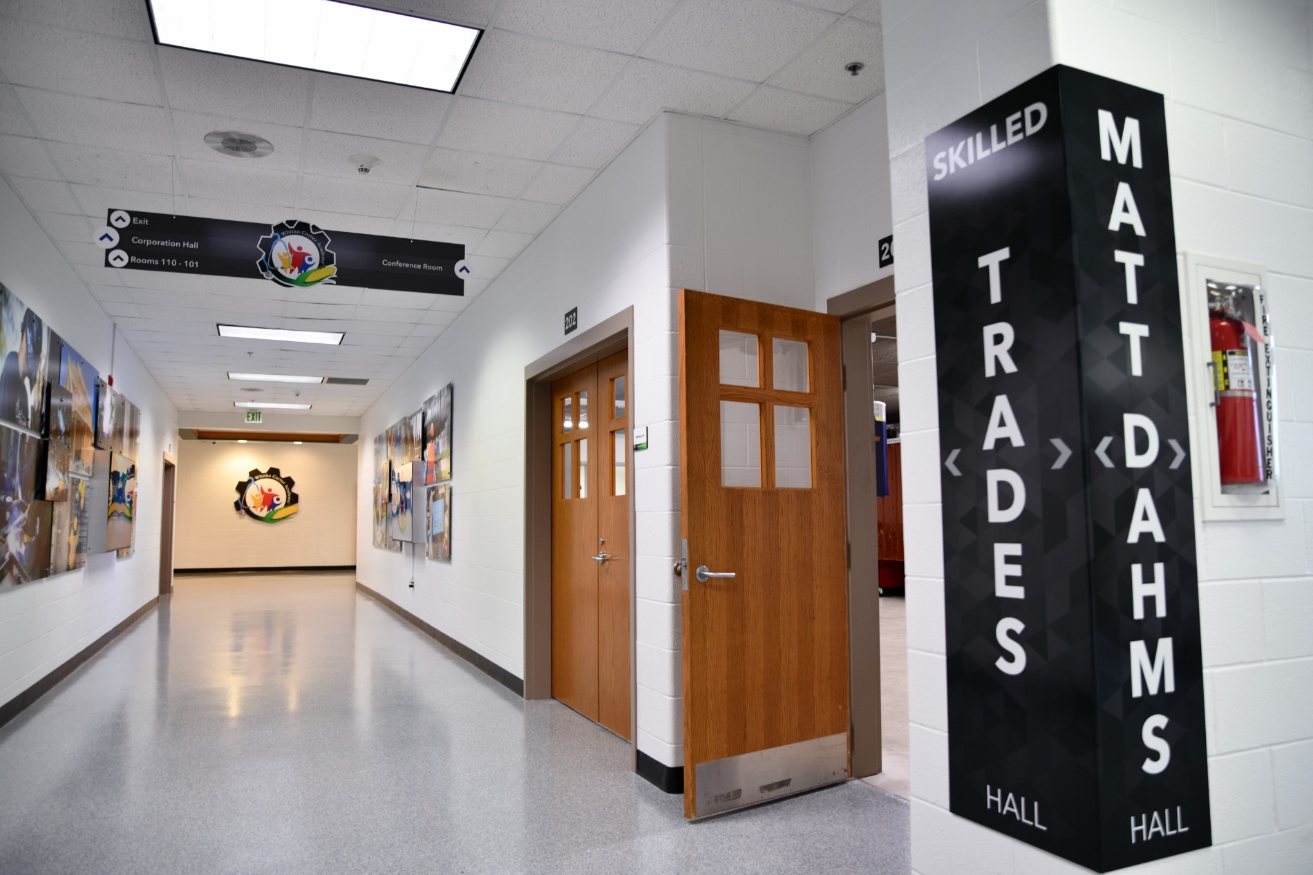 Whitko Career Academy hallway featuring wayfinding signage and wood doors
