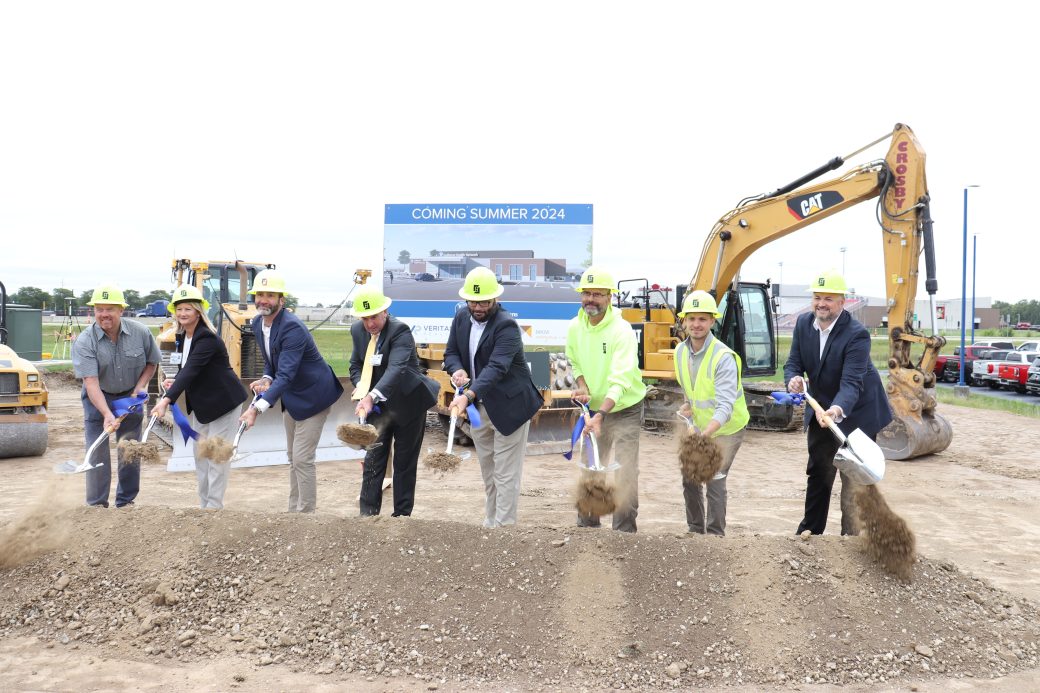 team of people with shovels and hard hats