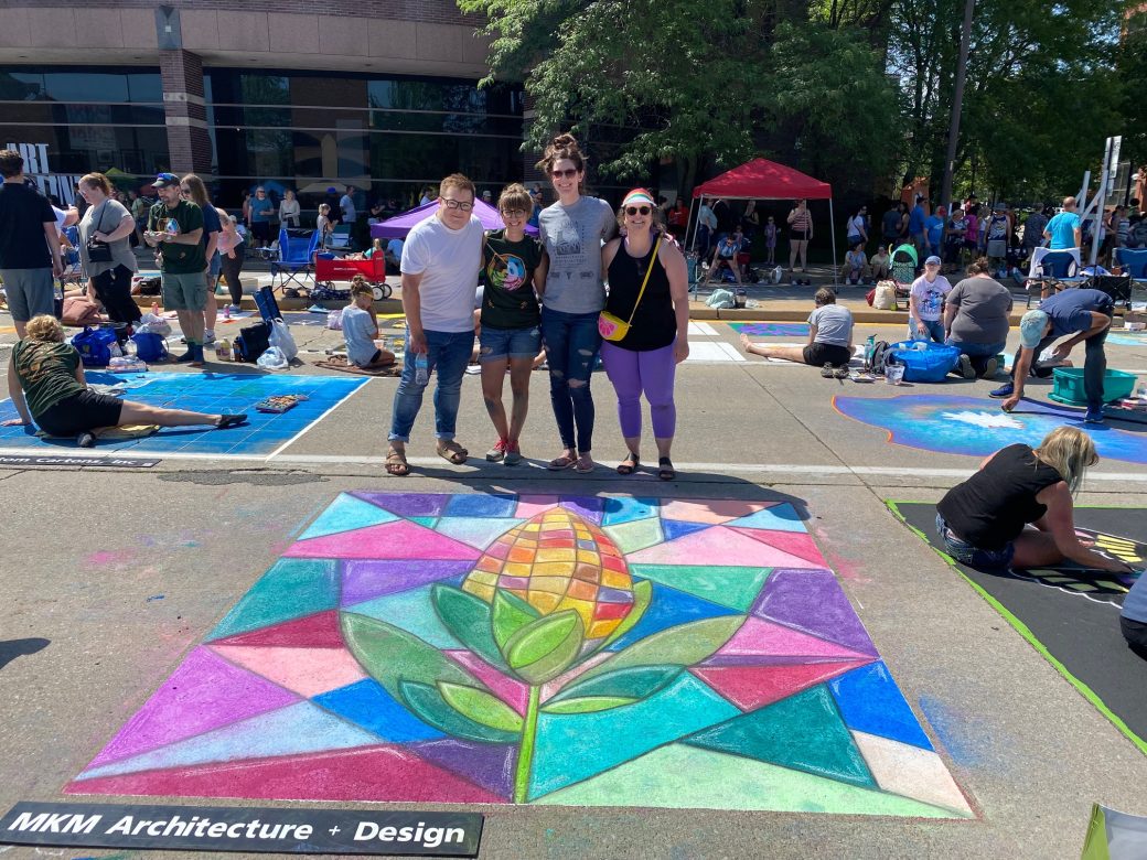 three people in front of chalk street art