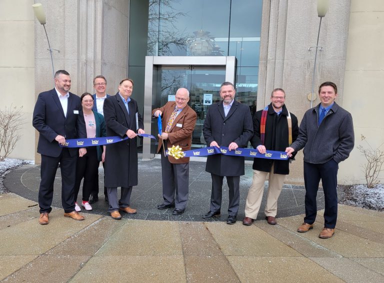 group of people at ribbon cutting ceremony