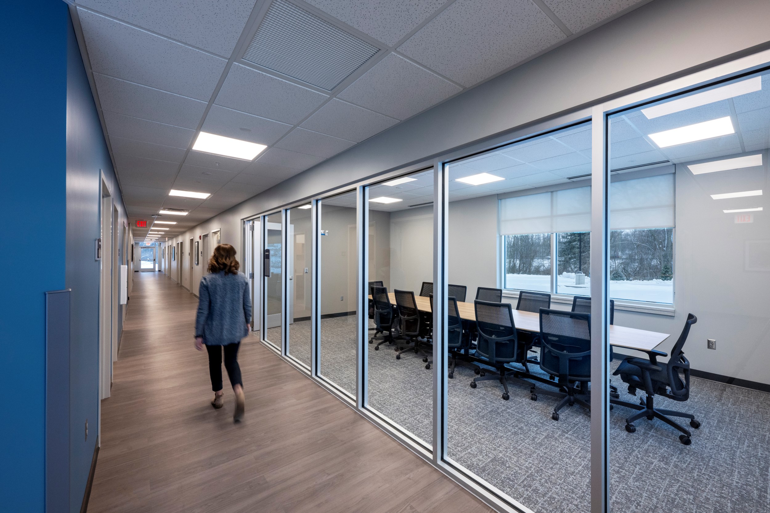 Bowen Health conference room and hallway with person walking
