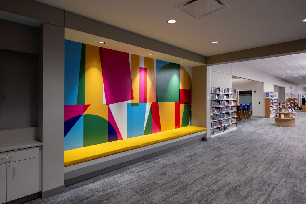 mural with colorful shapes in reading nook