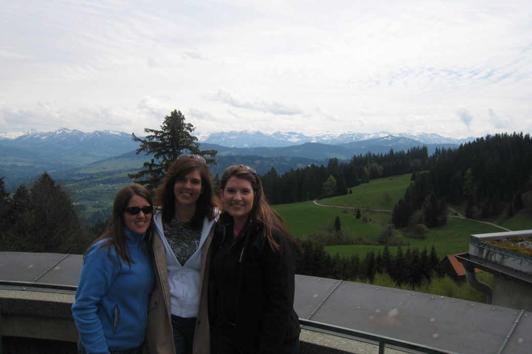 three women with mountain in background
