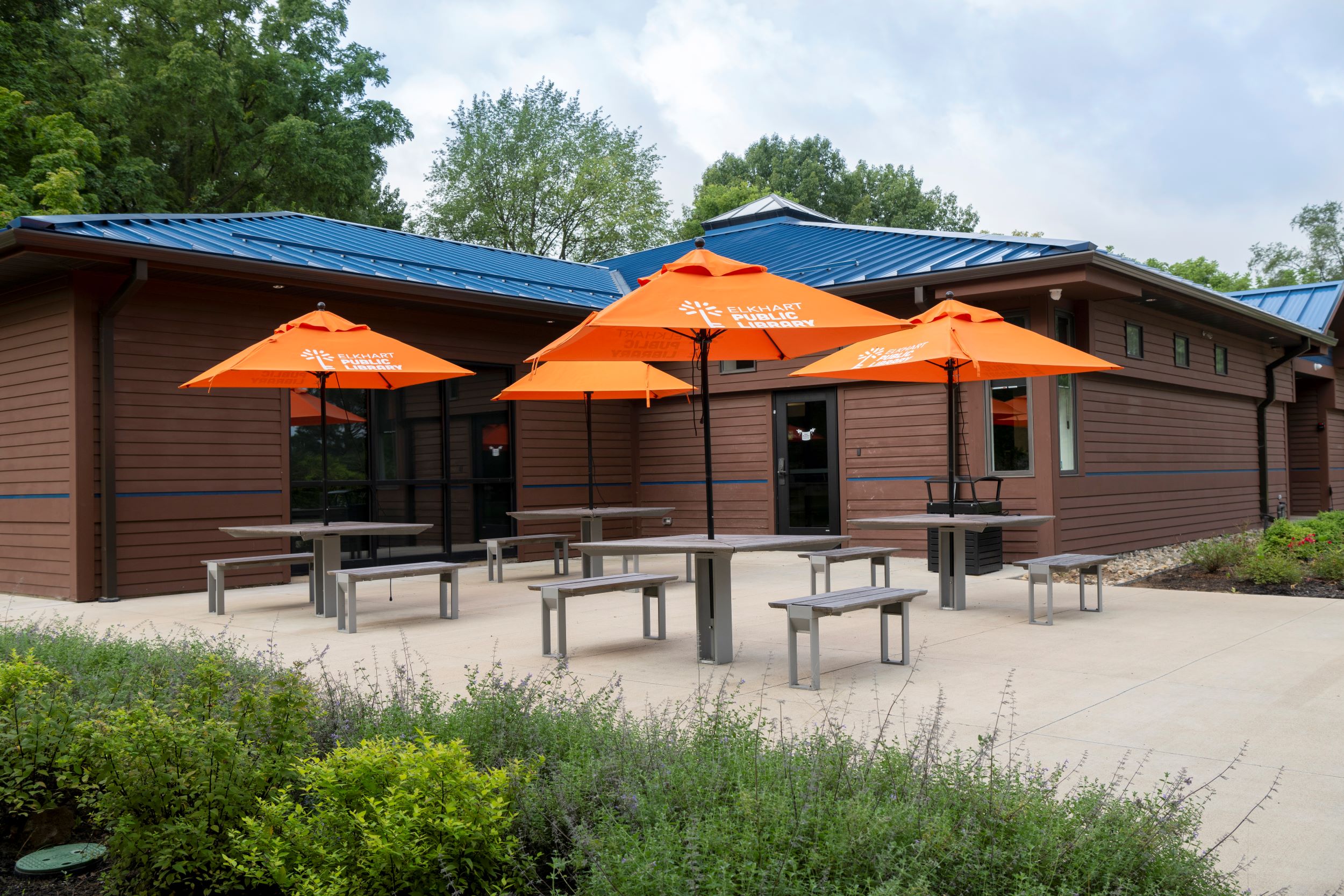 exterior tables with orange umbrellas