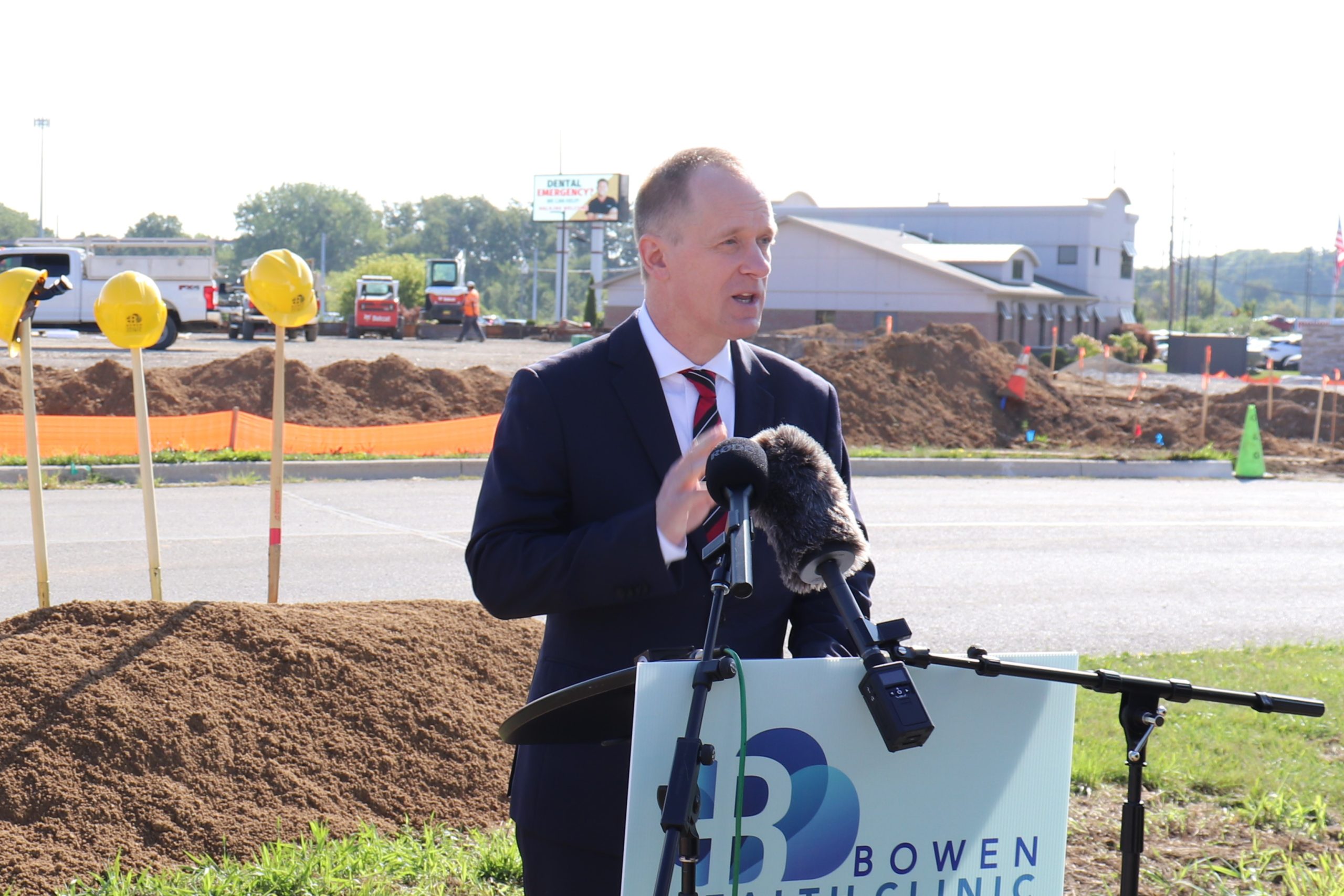 man speaking at a podium