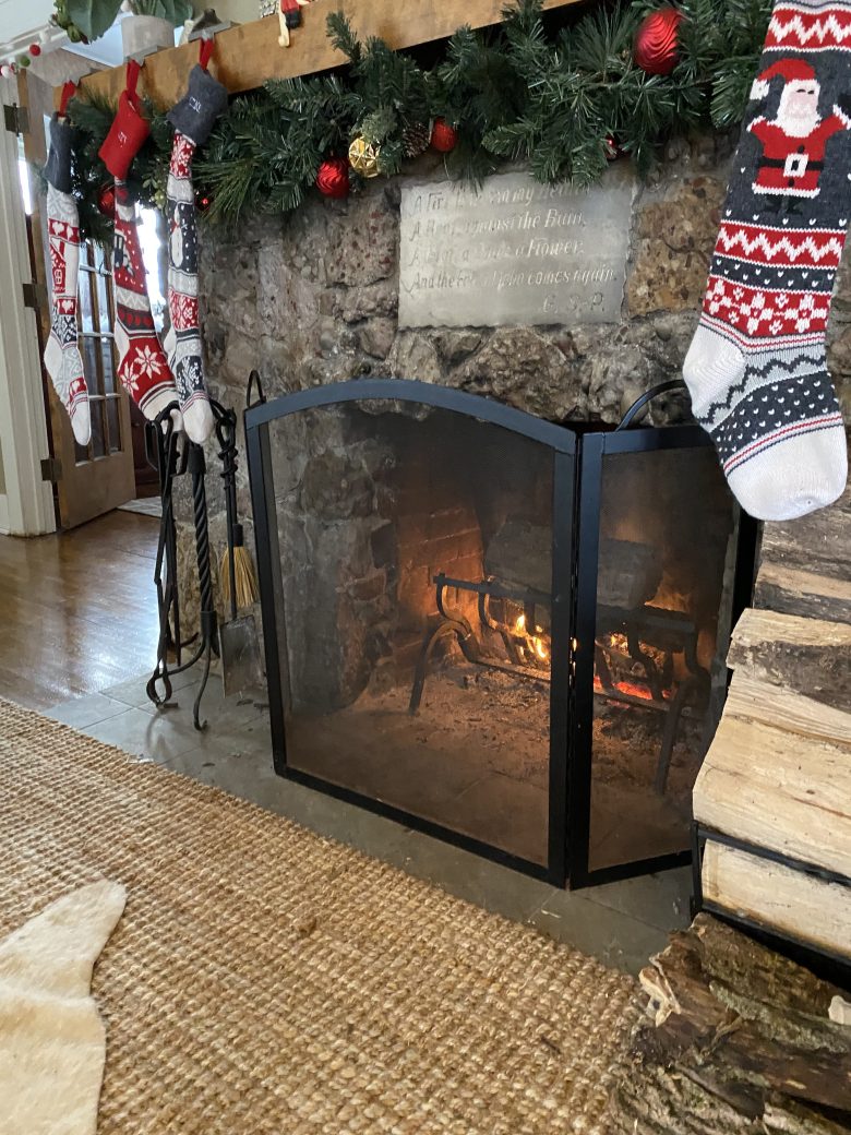 hearth with fire and stockings on mantle