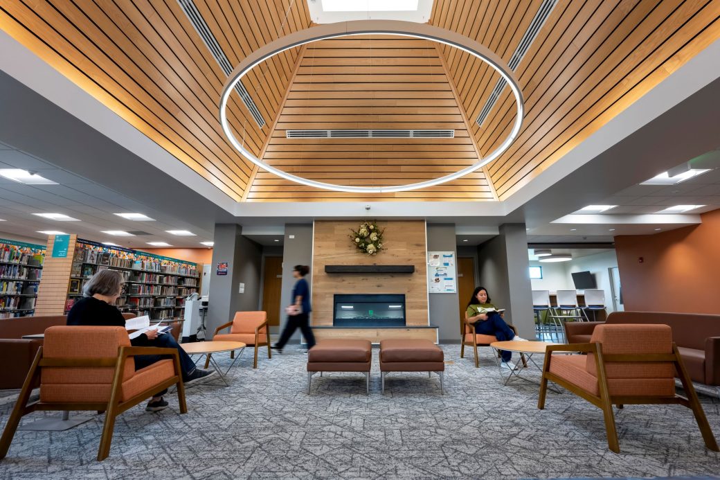 lounge with vaulted wood ceiling