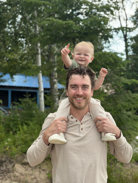 man with son on his shoulders