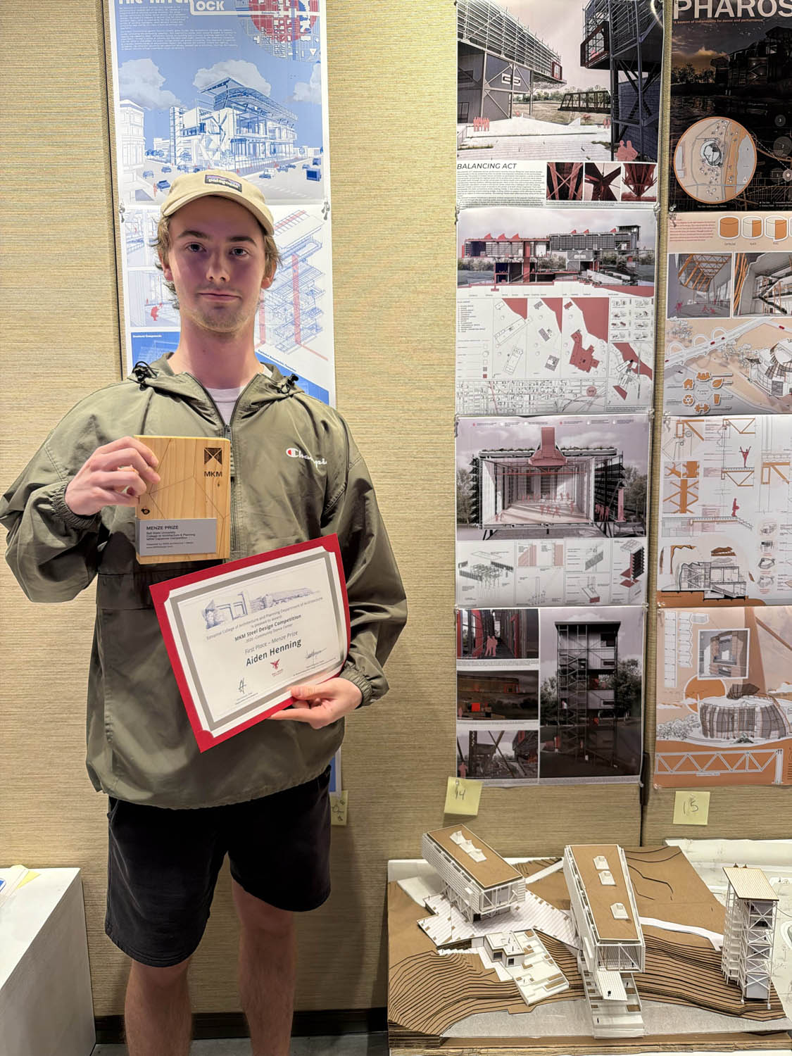 Aiden Henning holding first place certificate at MKM Steel Competition